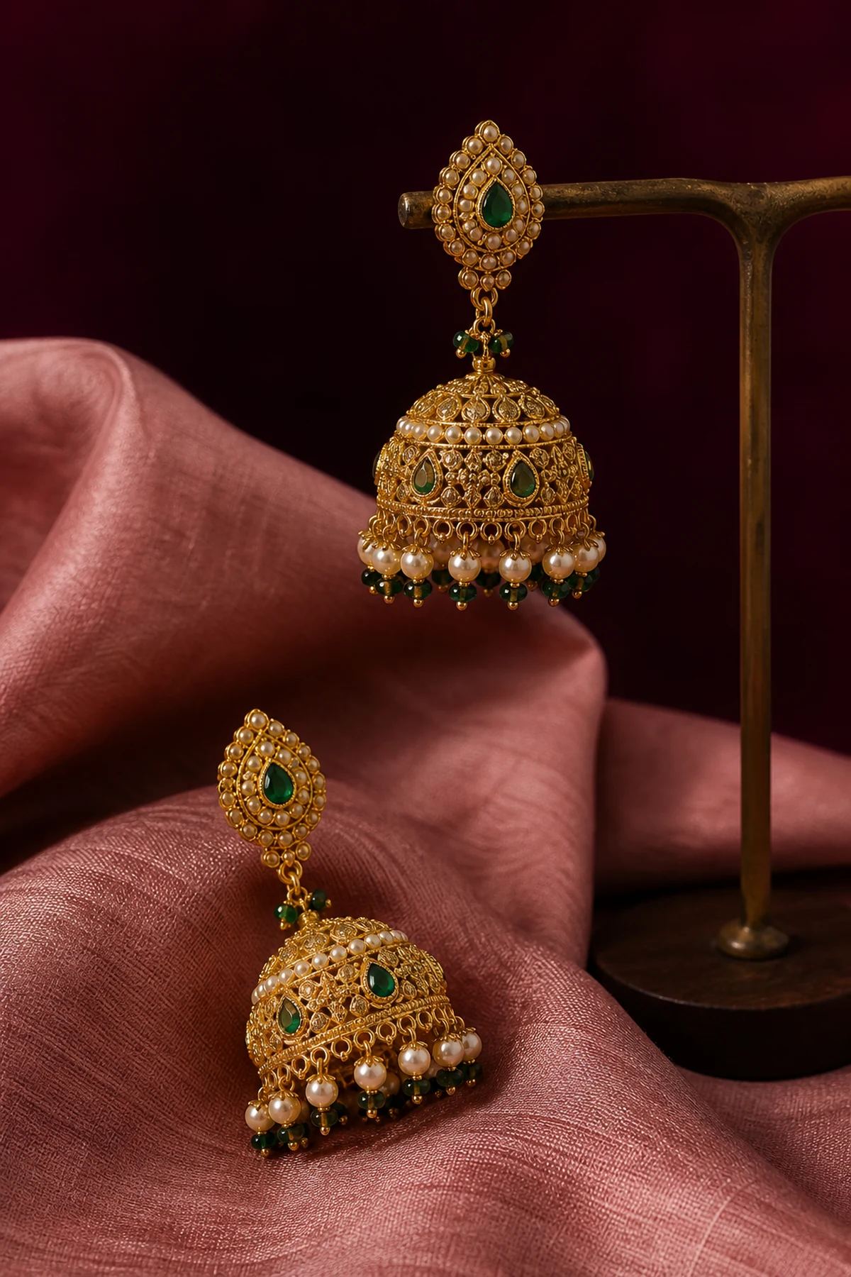 Gold jhumkas with pearl and emerald accents